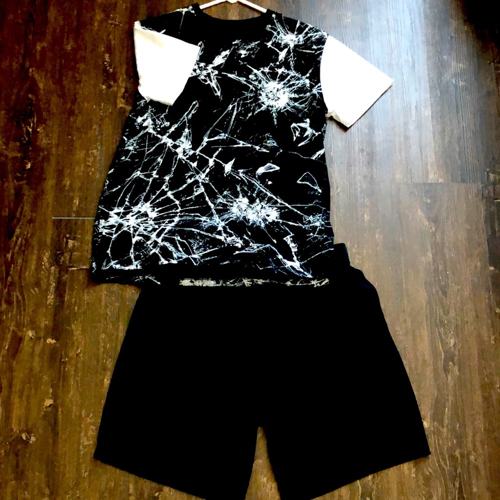 Black and white top with solid black shorts for boys.